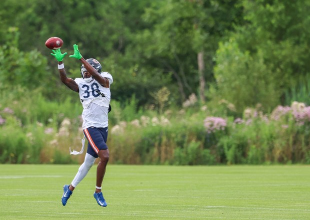 Chicago Bears cornerback Ameer Speed (38) attempts to catch a pass that instead bounced off his helmet during training camp at Halas Hall on July 29, 2025, in Lake Forest. (Stacey Wescott/Chicago Tribune)