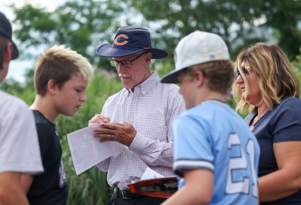 Chicago Bears owner George McCaskey signs autographs at Chicago Bears training camp at Halas Hall on July 29, 2025, in Lake Forest. McCaskey greeted fans, posed for photos, and signed autographs for Bears fans as they arrived. (Stacey Wescott/Chicago Tribune)