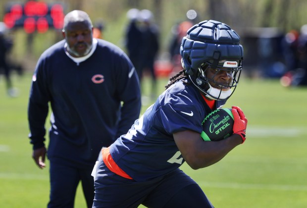 Running back Kyle Monangai carries the football during Bears rookie camp at Halas Hall on May 9, 2025, in Lake Forest. (Stacey Wescott/Chicago Tribune)