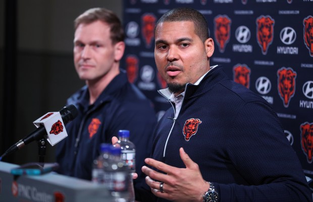 Bears general manager Ryan Poles speaks as coach Ben Johnson listens before introducing new players Drew Dalman and Dayo Odeyingbo on March 13, 2025, at Halas Hall. (Chris Sweda/Chicago Tribune)