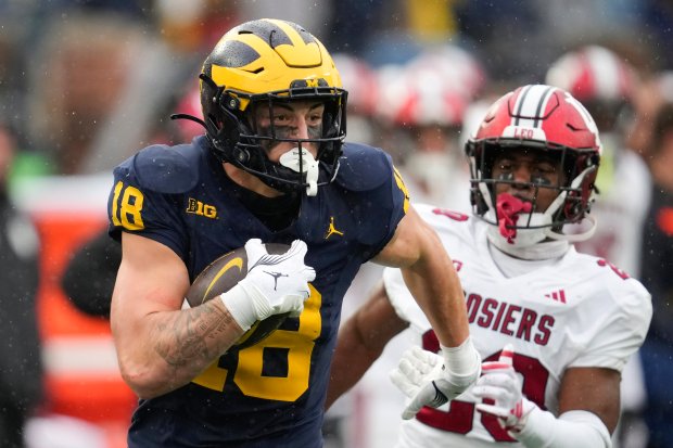 Michigan tight end Colston Loveland pulls away for a 54-yard touchdown reception against Indiana on Oct. 14, 2023, in Ann Arbor, Mich. (Paul Sancya/AP)