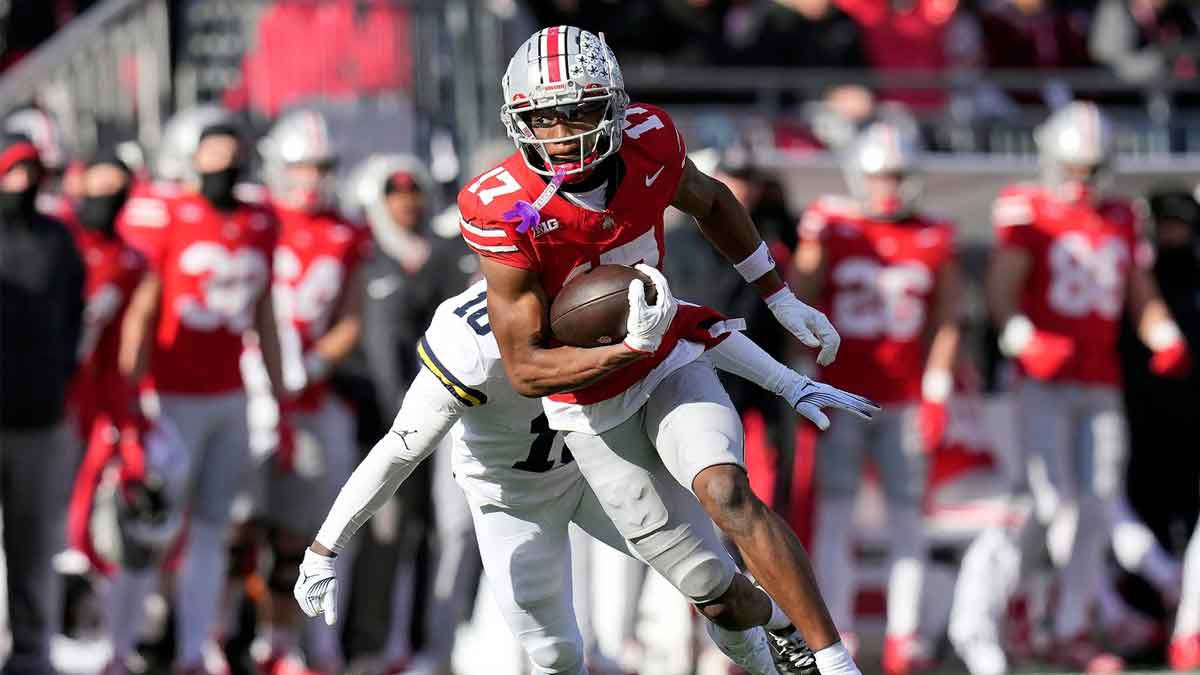 Ohio State receiver Carnell Tate runs after making a catch against Michigan.