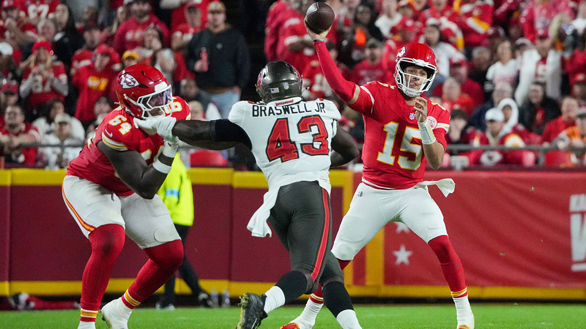 Kansas City Chiefs quarterback Patrick Mahomes (15) throws a pass as Tampa Bay Buccaneers linebacker Chris Braswell (43) defends during the first half at GEHA Field at Arrowhead Stadium.