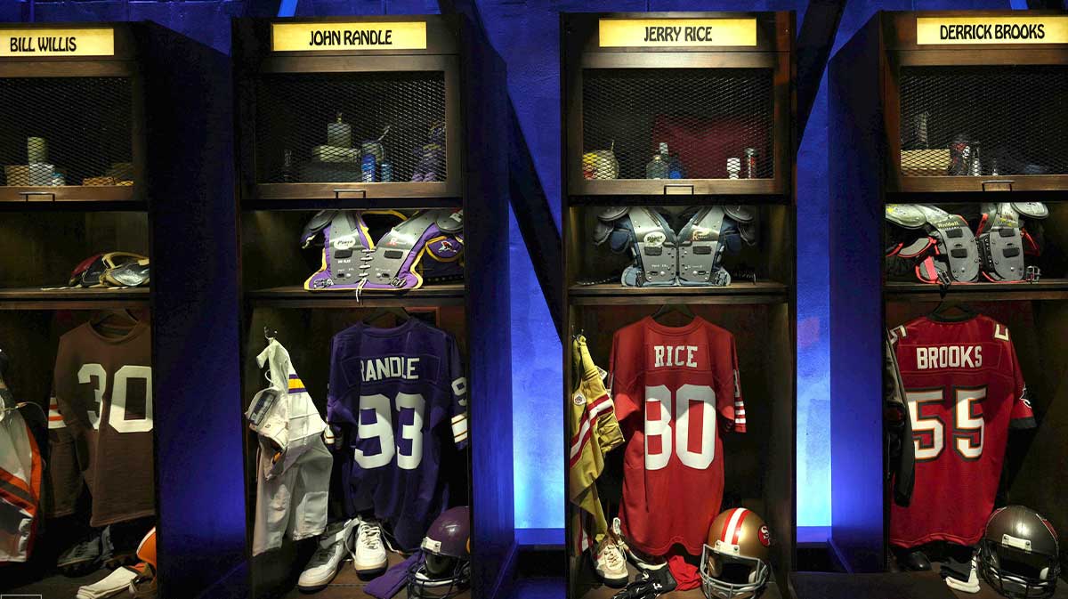 A locker room exhibit featuring Bill Willis, John Randle, Jerry Rice and Derrick Brooks at the Pro Football Hall of Fame.
