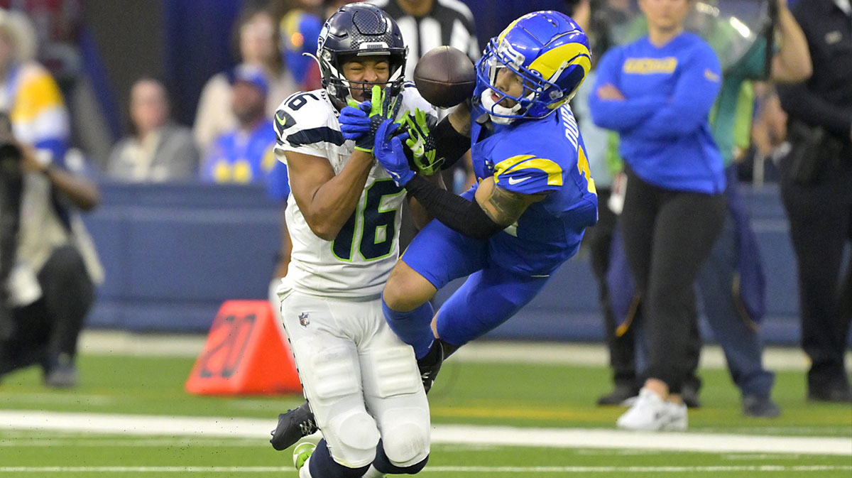 Los Angeles Rams cornerback Cobie Durant (14) breaks up a pass for Seattle Seahawks wide receiver Tyler Lockett (16) in the second half at SoFi Stadium. Mandatory Credit: Jayne Kamin-Oncea-Imagn Images