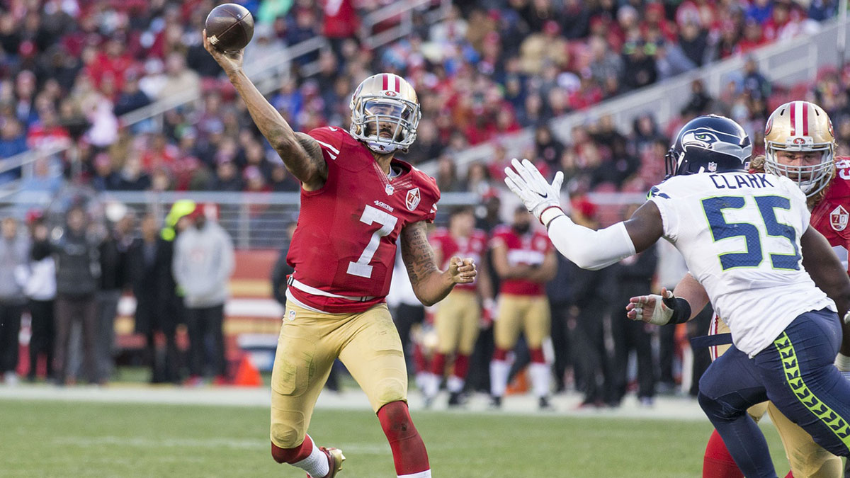 San Francisco 49ers quarterback Colin Kaepernick (7) passes the football against Seattle Seahawks defensive end Frank Clark (55) during the fourth quarter at Levis Stadium Seahawks defeated the 49ers 25-23. 