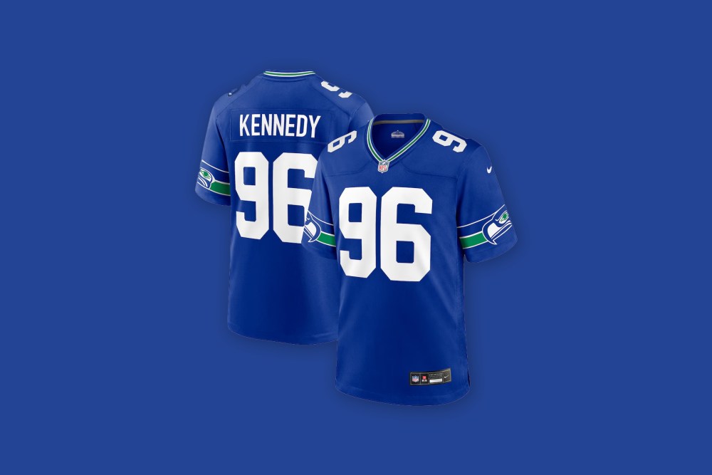 Front and back views of the Cortez Kennedy Seattle Seahawks Nike Alternate Game Jersey in bright blue against a bright blue background.