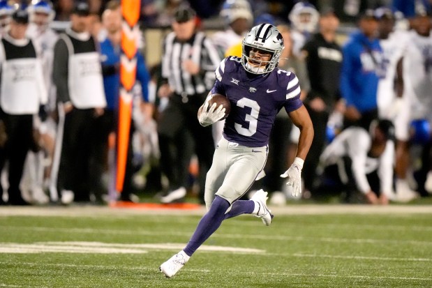 Kansas State running back Dylan Edwards runs the ball during the second half of an NCAA college football game against Kansas State, Saturday, Oct. 26, 2024, in Manhattan, Kan. (AP Photo/Charlie Riedel)