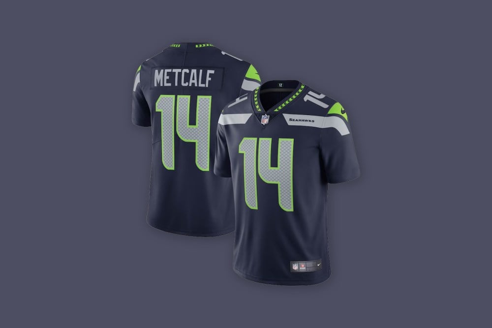 Front and back views of the DK Metcalf Seattle Seahawks Nike Vapor Limited Jersey in blue against a blue background.