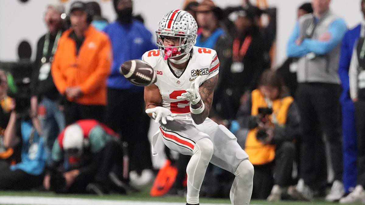 Ohio State Buckeyes wide receiver Emeka Egbuka (2) catches a pass against the Notre Dame Fighting Irish in the first half in the CFP National Championship college football game at Mercedes-Benz Stadium.