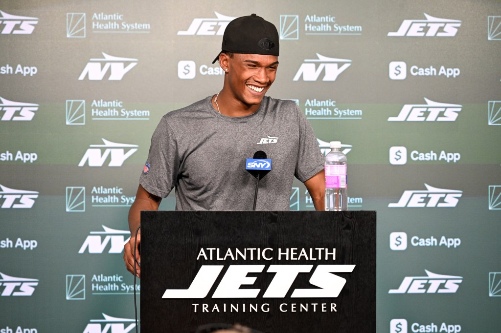 A happy Garrett Wilson, who signed a big extension with the Jets recently, is all smiles during a press conference on July 22, 2025.