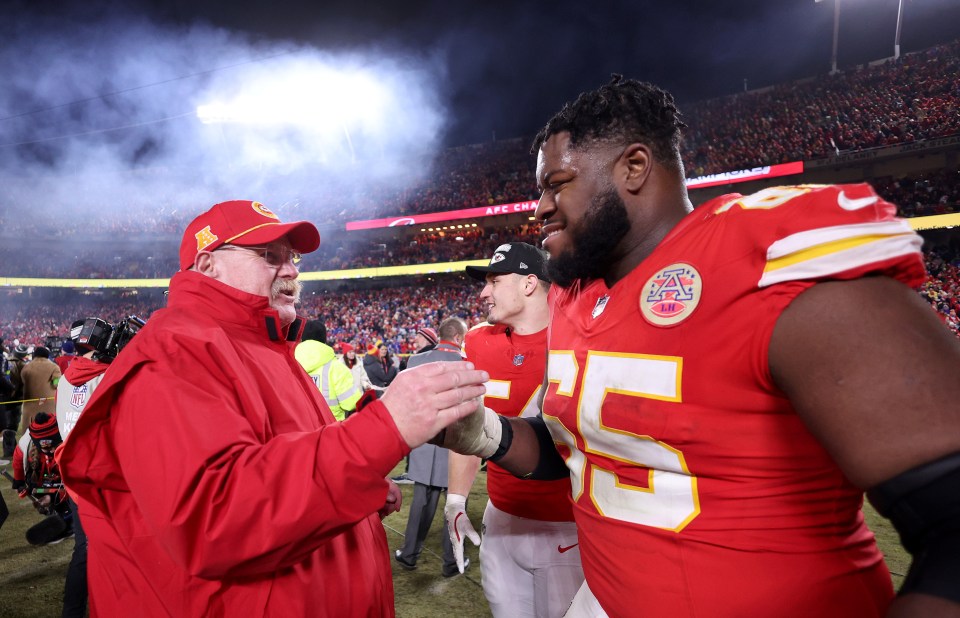 KANSAS CITY, MISSOURI - JANUARY 26: Head coach Andy Reid of the Kansas City Chiefs shakes hands with Trey Smith #65 after defeating the Buffalo Bills 32-29 in the AFC Championship Game at GEHA Field at Arrowhead Stadium on January 26, 2025 in Kansas City, Missouri.  (Photo by Jamie Squire/Getty Images)