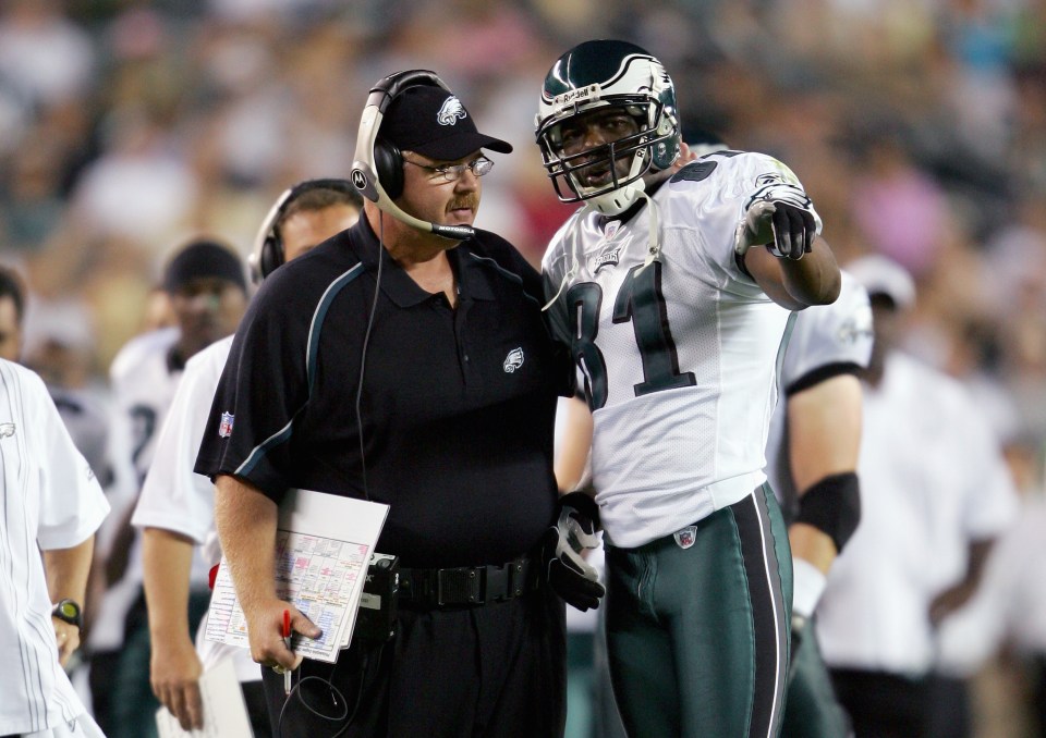 PHILADELPHIA- AUGUST 26:  Terrell Owens #81 of the Philadelphia Eagles talks with Head Caoch Andy Reid on the sideline during the preseason game with the Cincinnati Bengals on August 26, 2005 at Lincoln Financial Field in Philadelphia Pennsylvania.(Photo by Elsa/Getty Images).