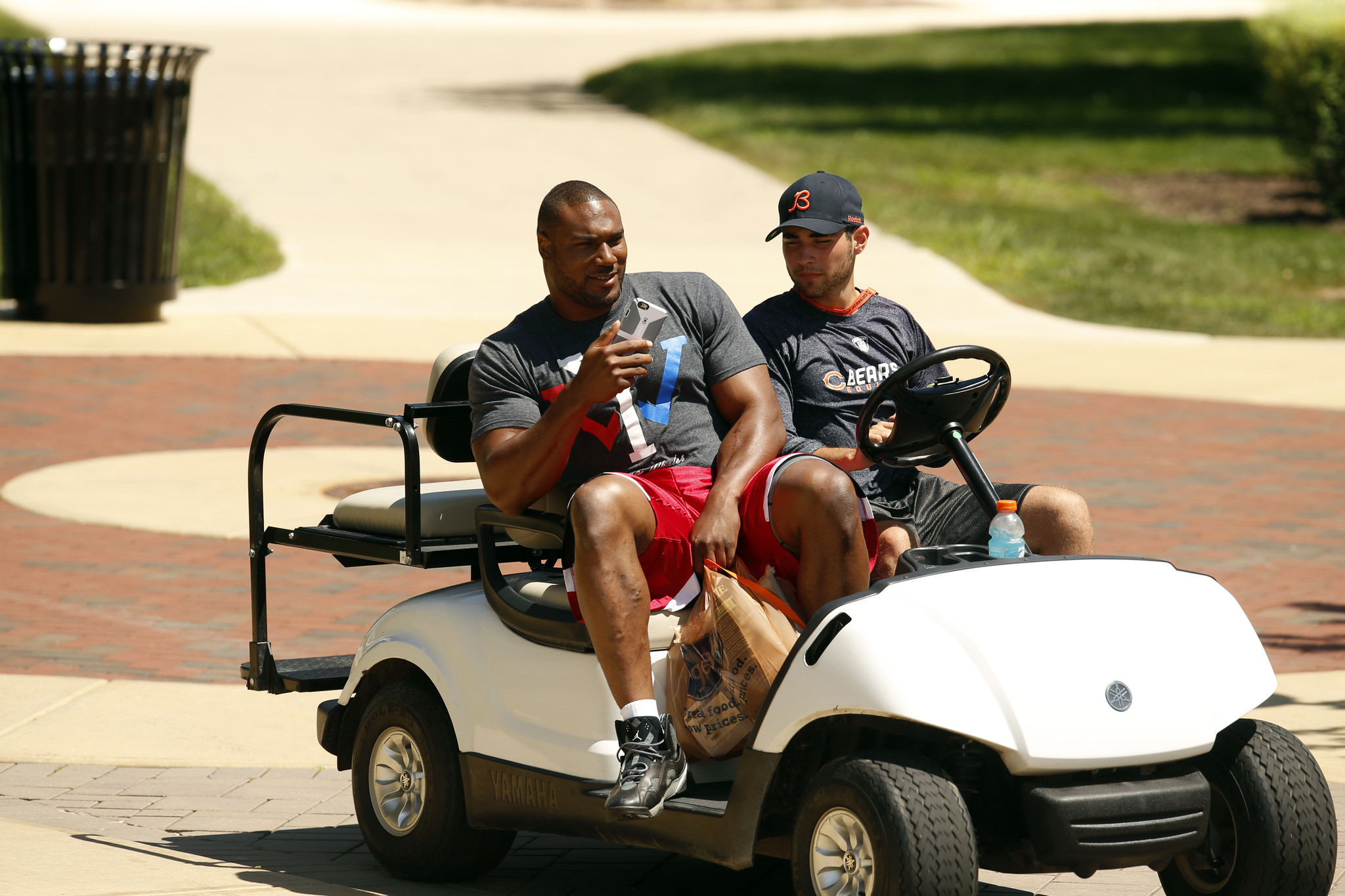 Defensive lineman Cornelius Washington gets a ride to his dorm as Bears players report to Olivet Nazarene University on July 29, 2015.