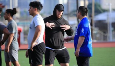 Former Kahuku and Colorado football standout BJ Beatty, middle, instructed Riki Shibuya (blue shirt), then a player for Tokyo University, at a clinic at Farrington High in February of 2024.