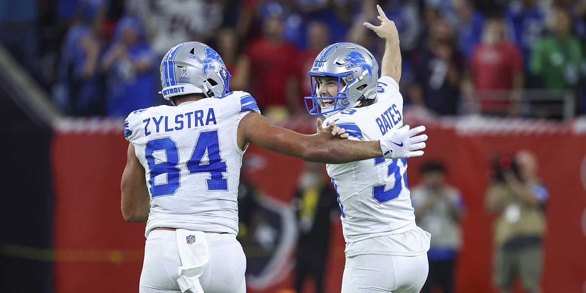 Detroit Lions place kicker Jake Bates (39) celebrates with tight end Shane Zylstra (84) after kicking a field goal with time expiring to give the Lions a win over the Houston Texans at NRG Stadium.