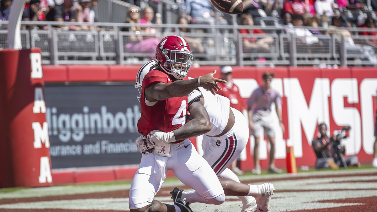 South Carolina Gamecocks edge Kyle Kennard (5) brings down Alabama Crimson Tide quarterback Jalen Milroe (4) in the end zone as he attempts to throw a pass during the second quarter at Bryant-Denny Stadium.