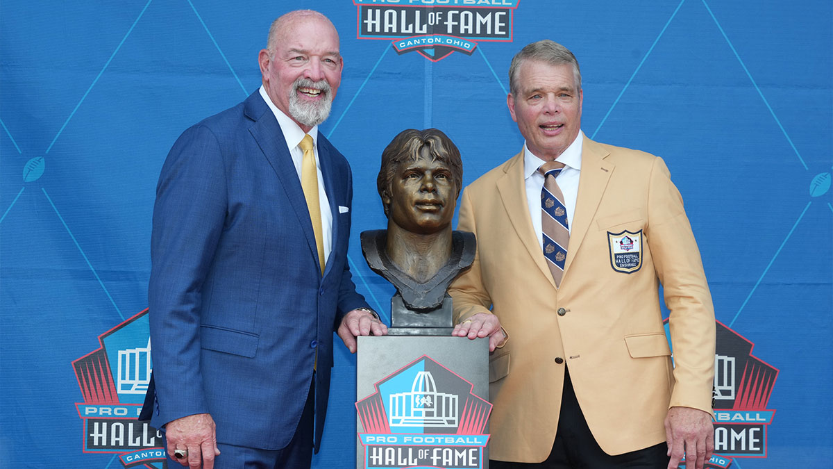 New York Jets and Indianapolis Colts former defensive lineman Joe Klecko poses with his bust and presenter Marty Lyons during the 2023 Pro Football Hall of Fame Enshrinement at Tom Benson Hall of Fame Stadium.