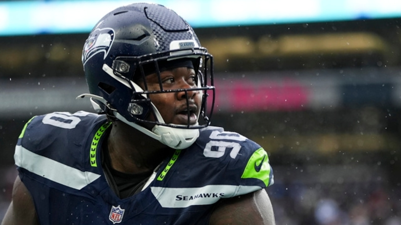 How many former Alabama players are on NFL training-camp rosters?