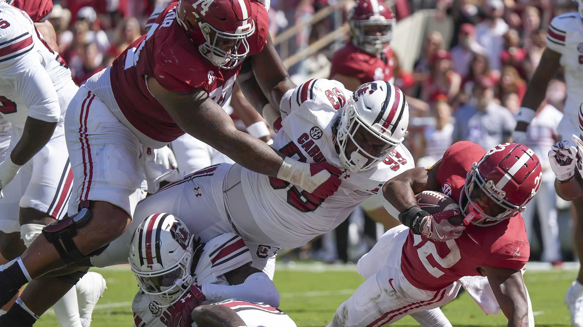 Alabama Crimson Tide running back Justice Haynes (22) lunges across the goal line as Alabama Crimson Tide offensive lineman Kadyn Proctor (74) blocks on South Carolina Gamecocks defensive tackle Nick Barrett (93) at Bryant-Denny Stadium.