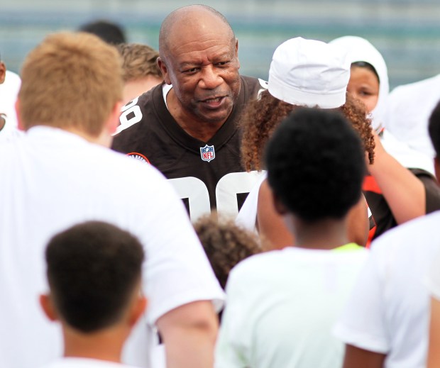 Former Brown Hanford Dixon motivates campers before drills in Lorain on July 9. (Randy Meyers - for The Morning Journal)