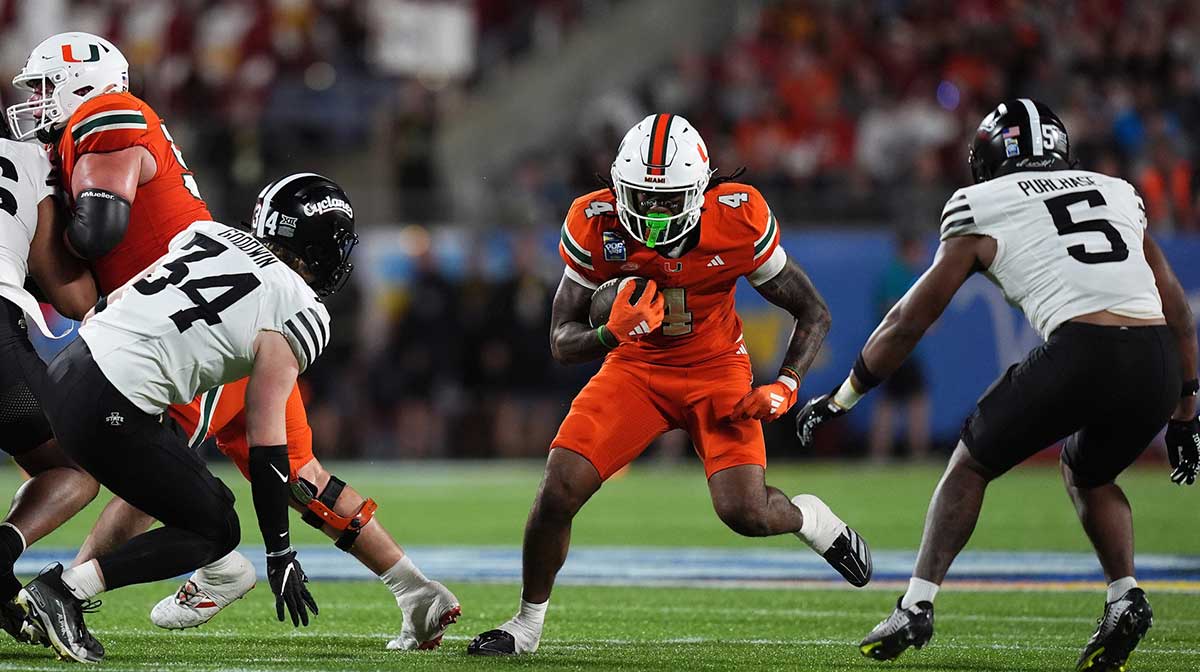 Miami Hurricanes running back Mark Fletcher Jr. (4) runs the ball against the Iowa State Cyclones during the second half at Camping World Stadium.