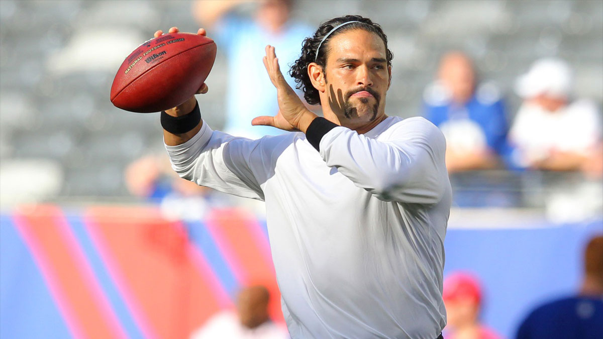 New York Jets quarterback Mark Sanchez (6) drops back to pass during warmups before a game against the New York Giants at MetLife Stadium. 