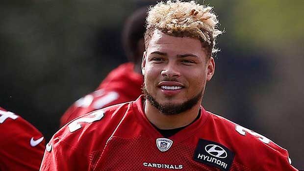 Arizona Cardinals defensive back Tyrann Mathieu waits his turn to run drills during an NFL football...