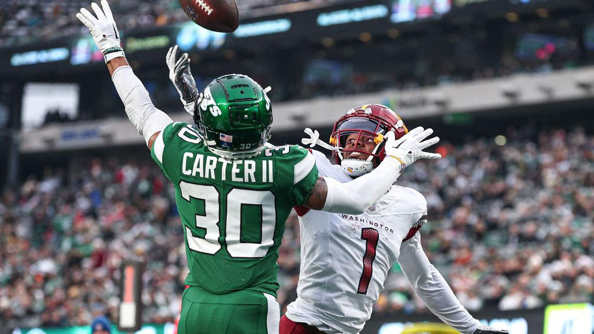 Dec 24, 2023; East Rutherford, New Jersey, USA; New York Jets cornerback Michael Carter II (30) breaks up a pass intended for Washington Commanders wide receiver Jahan Dotson (1) during the second half at MetLife Stadium. 