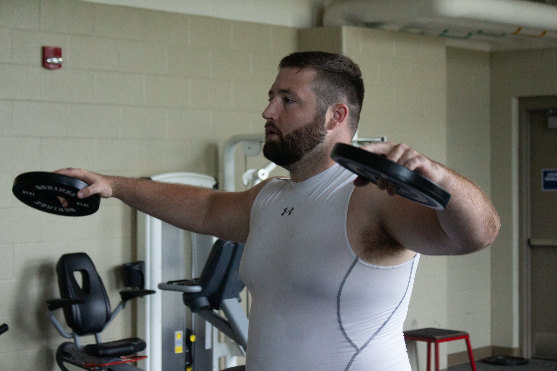 Jack Hasz does a shoulder workout in Creighton Prep's gym.