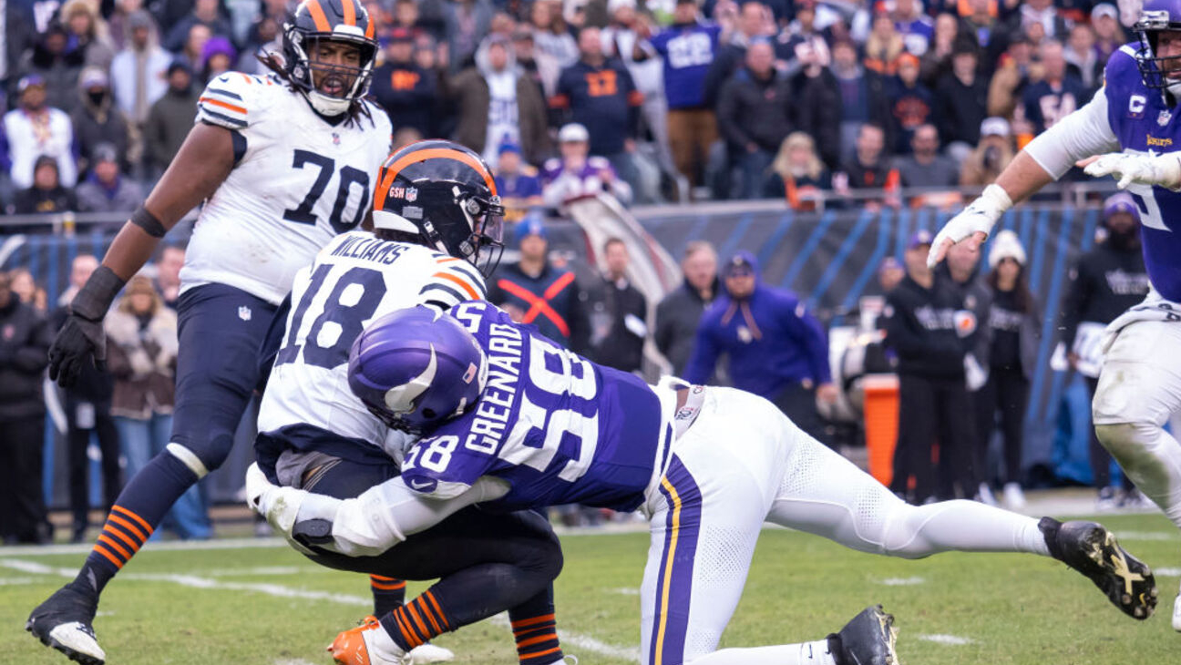 CHICAGO, IL - NOVEMBER 24: Chicago Bears quarterback Caleb Williams (18) gets sacked by Minnesota Vikings linebacker Jonathan Greenard (58) during a regular season game between the Minnesota Vikings and the Chicago Bears on November 24, 2024, at Soldier Field in Chicago, Illinois. (Photo by Joseph Weiser/Icon Sportswire via Getty Images)