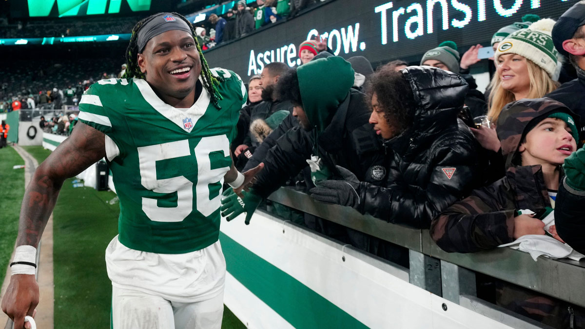 New York Jets linebacker Quincy Williams (56) gives high-fives to fans after Gang Green who their final game of the season, 32-20, Sunday January 5, 2025, in East Rutherford.