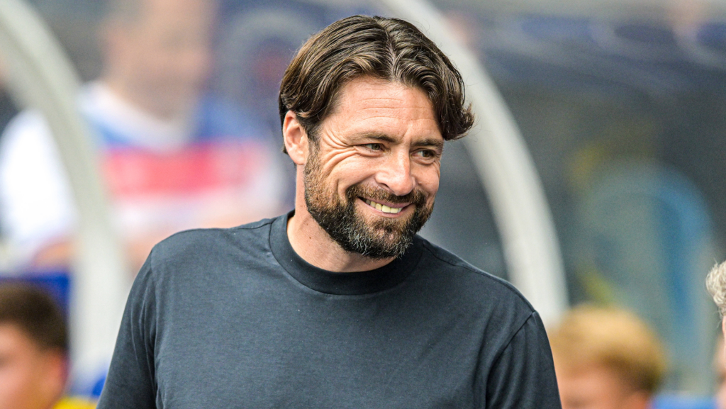 Rangers manager Russell Martin smiles.