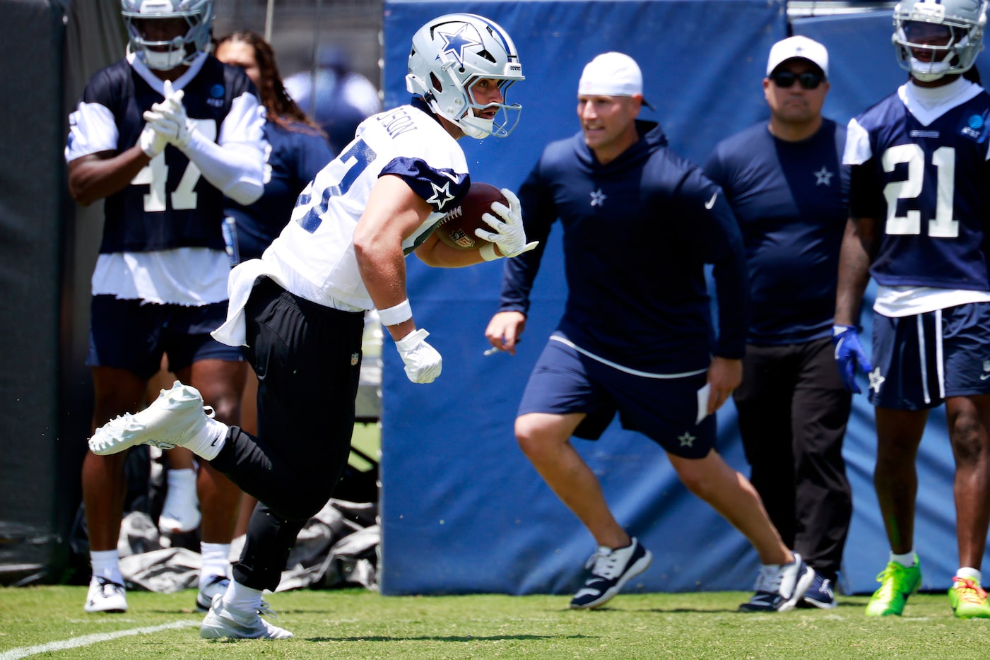 Dallas Cowboys tight end Jake Ferguson (87) turns up field after making a catch during the...