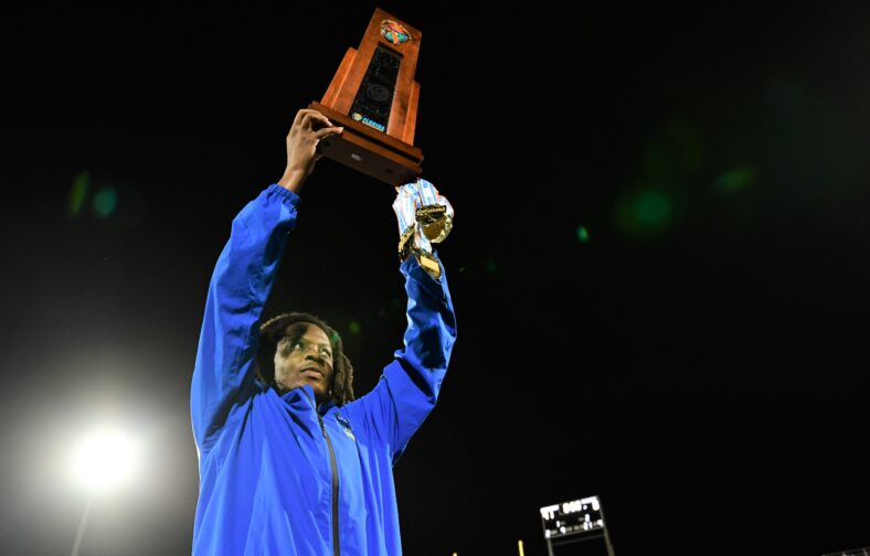 Teddy Bridgewater holding Florida State Championship trophy