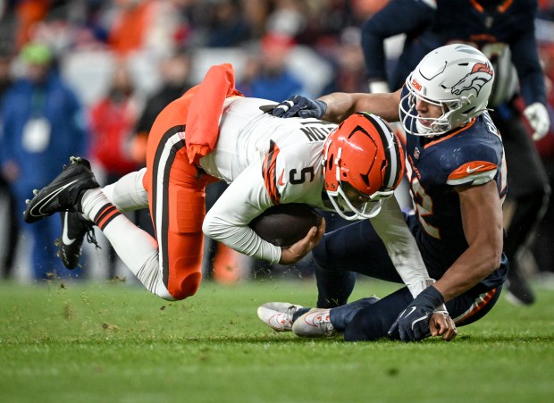 Jonah Elliss (52) of the Denver Broncos tackles Jameis Winston (5) of the Cleveland Browns during the second quarter at Empower Field at Mile High on Monday, Dec. 2, 2024. (Photo by AAron Ontiveroz/The Denver Post)