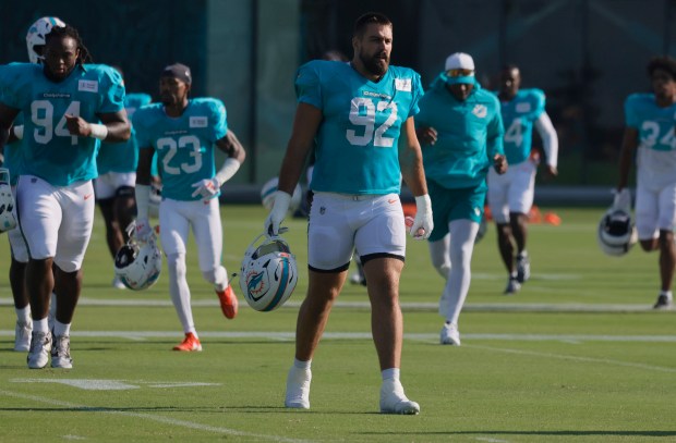 Miami Dolphins defensive tackle Zach Sieler (92) leads the defense...