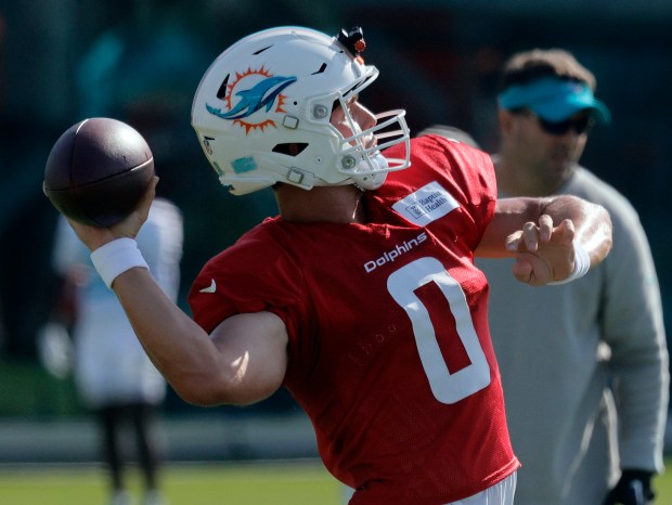 Miami Dolphins quarterback Zach Wilson (0) throws during practice Tuesday,...