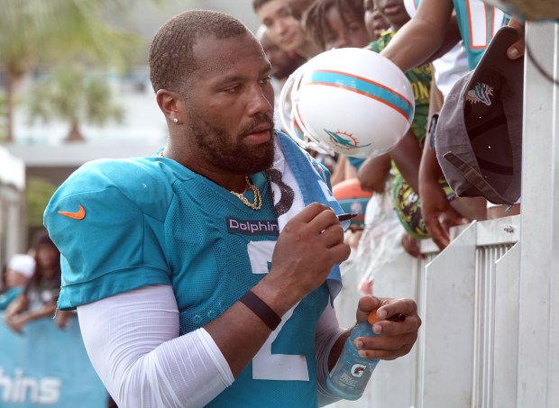 Miami Dolphins linebacker Bradley Chubb (2) signs for fans during...