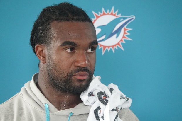 Miami Dolphins linebacker Tyrel Dodson (11) speaks during practice Tuesday,...