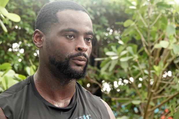 Miami Dolphins offensive tackle Kion Smith (71) speaks to the...