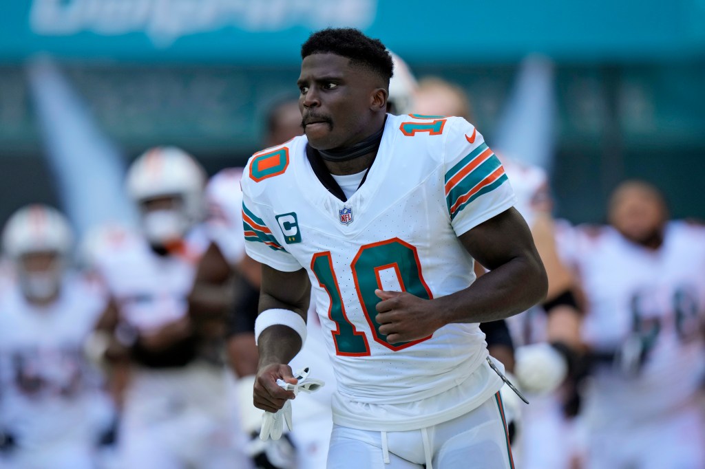 Football player wearing a Miami Dolphins jersey.