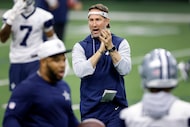 Dallas Cowboys head coach Brian Schottenheimer walks the field firing up his players during...