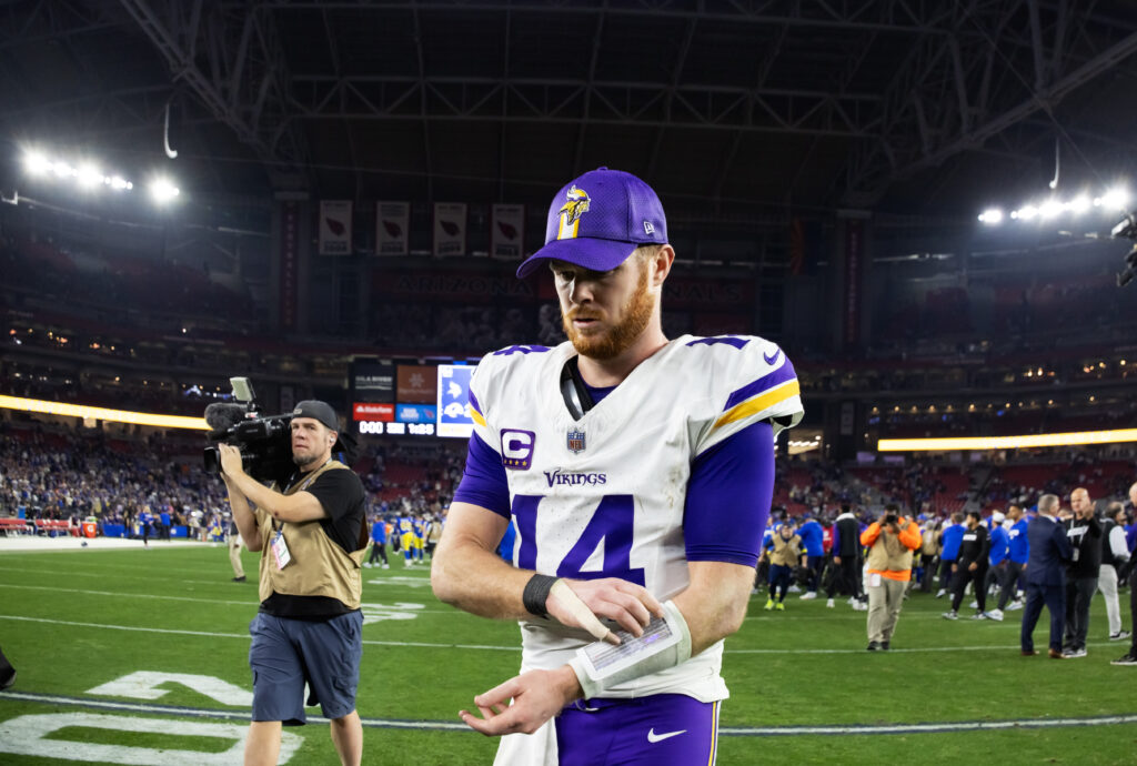 Minnesota Vikings quarterback Sam Darnold (14) reacts as he walks off the field after losing to the Los Angeles Rams at State Farm Stadium.