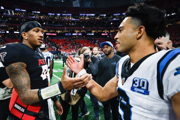 Atlanta Falcons quarterback Michael Penix Jr. (left) greets Carolina Panthers quarterback Bryce Young (right) at the end of the game on Sunday, January 5, 2025, at Mercedes-Benz Stadium in Atlanta. Falcons lost in overtime 44-38.
(Miguel Martinez/ AJC)