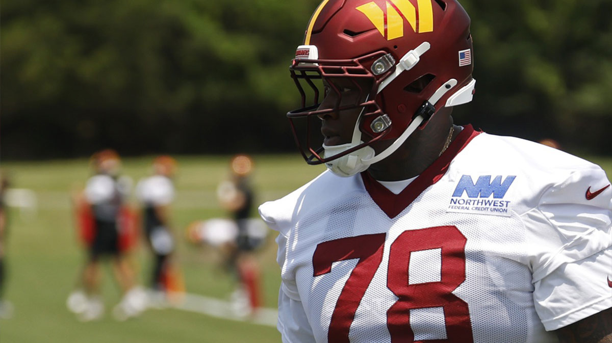 Washington Commanders offensive tackle Laremy Tunsil (78) stands on the field on day one of minicamp at Commanders Park.