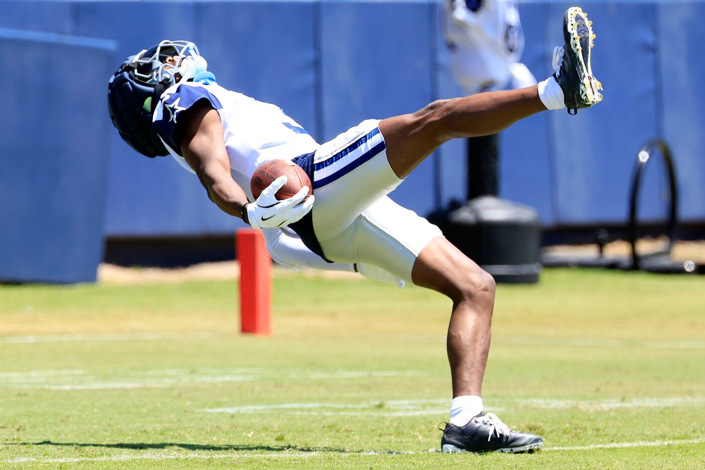 Dallas Cowboys wide receiver George Pickens (3) falls backwards over the goal line as he ran...