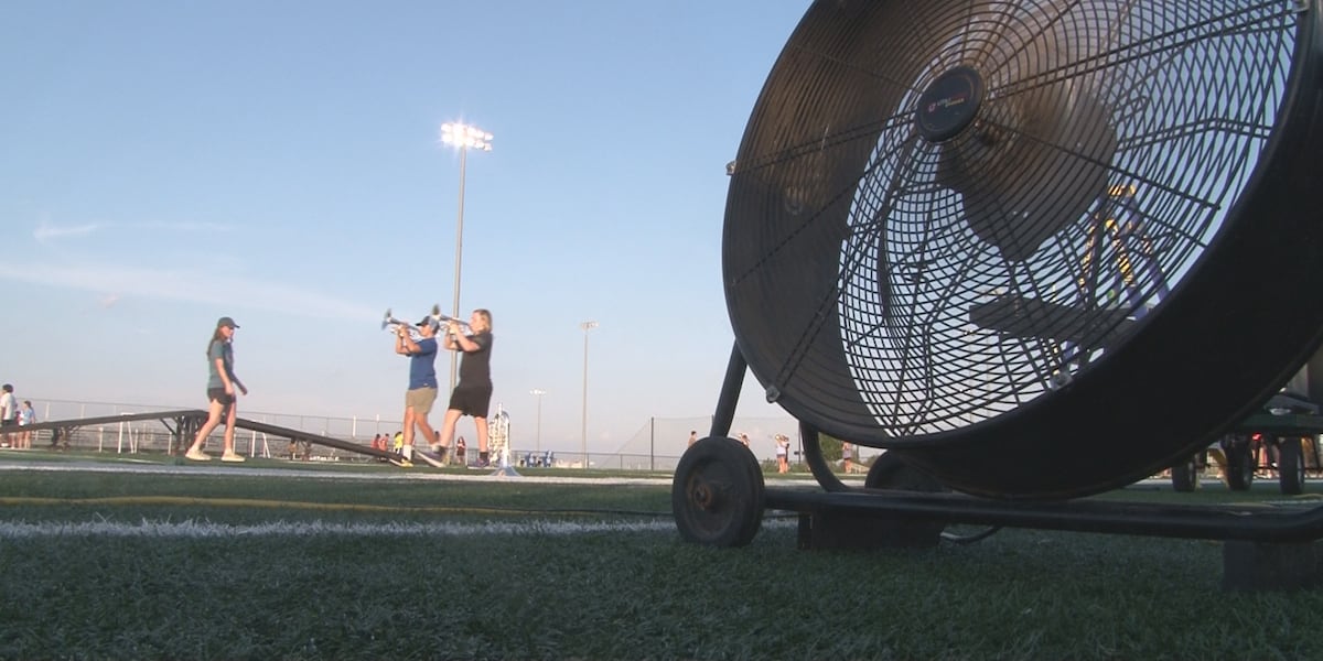 High school marching bands battle summer heat ahead of football season