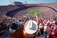 Texas fans cheer the Longhorns band before an NCAA college football game against Oklahoma at...