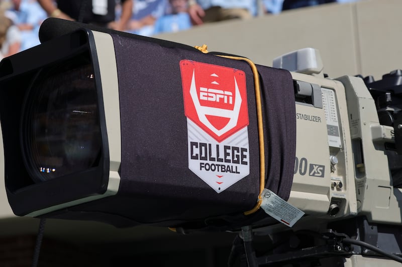 An ESPN logo appears on a camera before an NCAA college football game.
